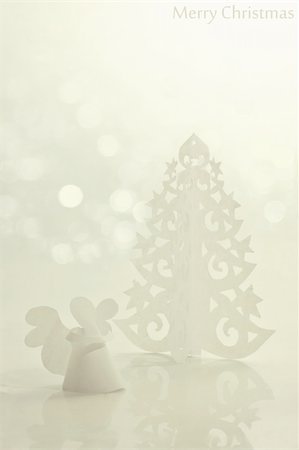 Handmade angel and Christmas tree cut out from office paper Stock Photo - Budget Royalty-Free & Subscription, Code: 400-05730756