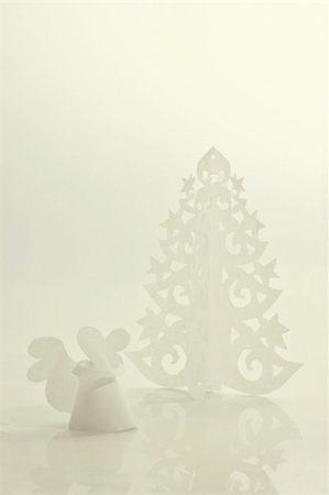 Handmade angel and Christmas tree cut out from office paper Stock Photo - Budget Royalty-Free & Subscription, Code: 400-05730757