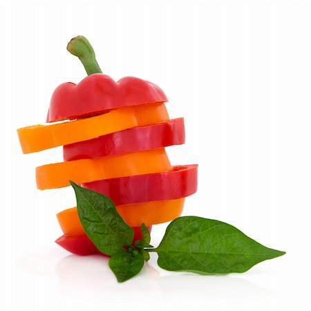 simsearch:400-06061963,k - Red and orange pepper vegetables sliced in a stack with leaf spring isolated over white background. Foto de stock - Royalty-Free Super Valor e Assinatura, Número: 400-05730962