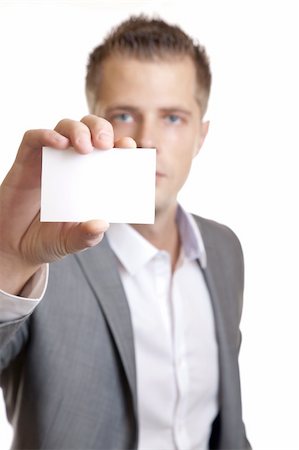 simsearch:400-06060056,k - Young businessman showing an empty business card Foto de stock - Super Valor sin royalties y Suscripción, Código: 400-05731146