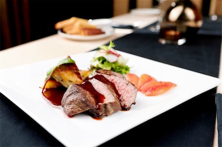 eating seafood restaurant - Beef fillet with potato gratin and fresh salad Stock Photo - Budget Royalty-Free & Subscription, Code: 400-05731299