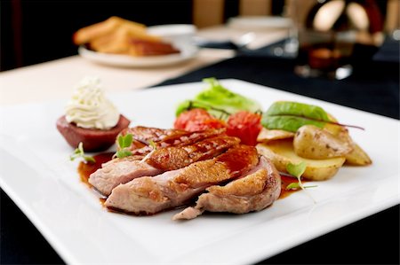 simsearch:400-05335169,k - Roasted duck with pear,marinated in red wine and mascarpone rose Stock Photo - Budget Royalty-Free & Subscription, Code: 400-05731302