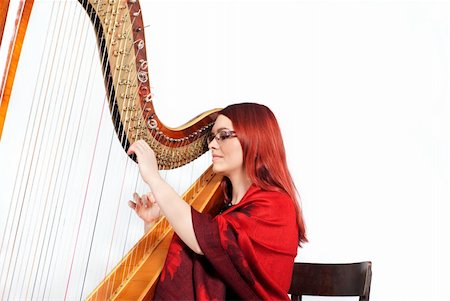 Redhead Girl and Wooden Harp isolated on white Foto de stock - Super Valor sin royalties y Suscripción, Código: 400-05731499