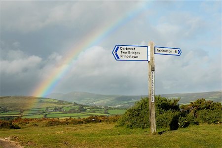 swellphotography (artist) - Rainbow over a signpost on dartmoor, Devon, UK. Fotografie stock - Microstock e Abbonamento, Codice: 400-05731673
