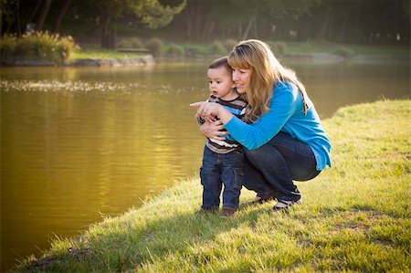 Happy Mother and Baby Son Looking Out At The Pretty Lake. Stock Photo - Budget Royalty-Free & Subscription, Code: 400-05732076