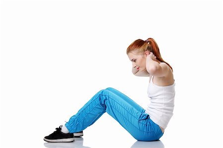 Beautiful caucasian teen girl doing exercises on the floor over white. Stock Photo - Budget Royalty-Free & Subscription, Code: 400-05732664