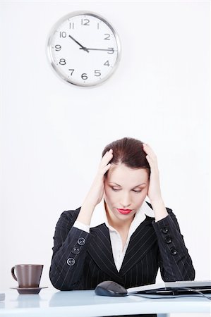 Pretty caucasian tired businesswoman sitting in the office. Stock Photo - Budget Royalty-Free & Subscription, Code: 400-05732692