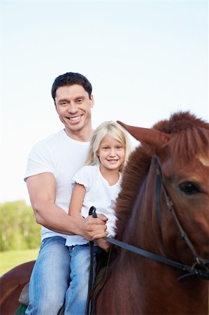 simsearch:400-05748585,k - Father and daughter on a horse Foto de stock - Super Valor sin royalties y Suscripción, Código: 400-05732858