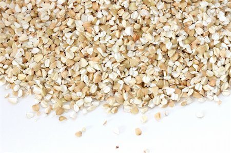 danicek (artist) - Scattered view of dry raw pealed buckwheat on white background Foto de stock - Super Valor sin royalties y Suscripción, Código: 400-05733925