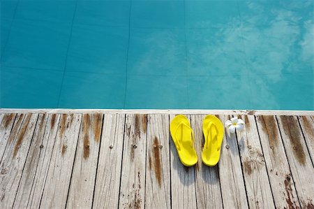 sandals resort - Yellow sandals by a swimming pool Foto de stock - Royalty-Free Super Valor e Assinatura, Número: 400-05744590