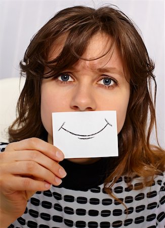 fake happiness mask - Tired woman smiles as may - portrait close up Stock Photo - Budget Royalty-Free & Subscription, Code: 400-05745166
