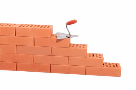 red bricks and trowel, photo on the white background Foto de stock - Super Valor sin royalties y Suscripción, Código: 400-05745228