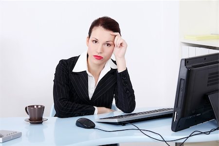 frustrated office worker with hands in hair - Pretty caucasian tired businesswoman sitting in the office. Stock Photo - Budget Royalty-Free & Subscription, Code: 400-05745313