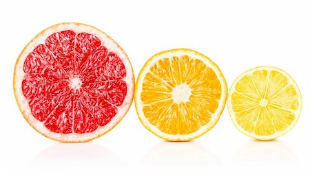 simsearch:400-04164071,k - fresh fruits orange lemon grapefruit in cut isolated on white background Stock Photo - Budget Royalty-Free & Subscription, Code: 400-05745872