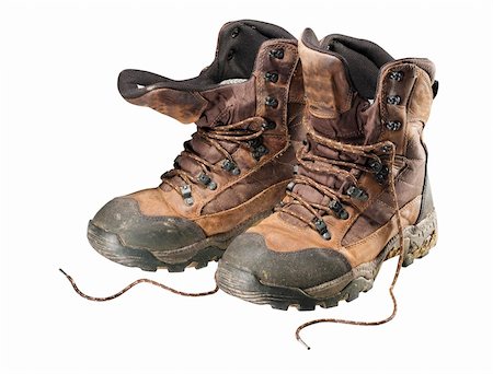 A pair of old hiking boots isolated on white background Fotografie stock - Microstock e Abbonamento, Codice: 400-05745926