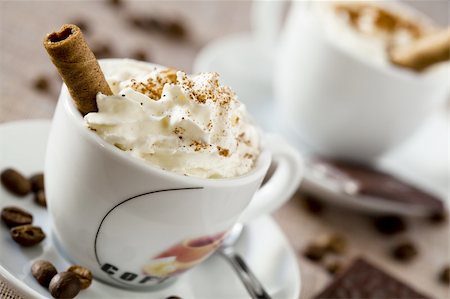 Photograph of two coffee cups with whipped cream and chocolate candy Stock Photo - Budget Royalty-Free & Subscription, Code: 400-05745930