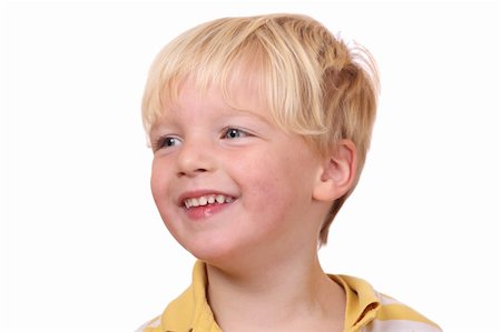 simsearch:400-05745952,k - Portrait of a smiling young boy on white background Stock Photo - Budget Royalty-Free & Subscription, Code: 400-05745945