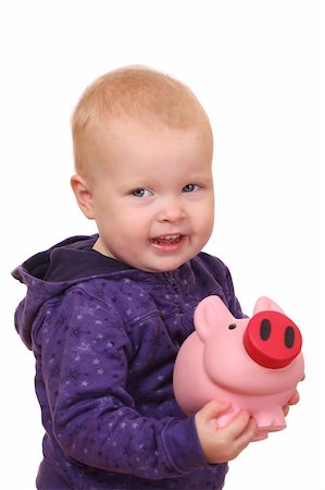 Portrait of a happy toddler showing a pink piggybank Stock Photo - Budget Royalty-Free & Subscription, Code: 400-05745958