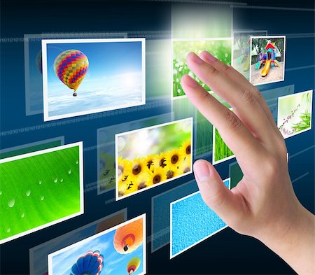 future earth icon - hand pressing a button streaming images on a touch screen interface Stock Photo - Budget Royalty-Free & Subscription, Code: 400-05746308