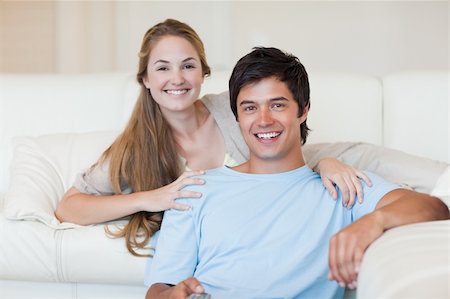 simsearch:400-05748048,k - Smiling couple watching television in their living room Stockbilder - Microstock & Abonnement, Bildnummer: 400-05746689