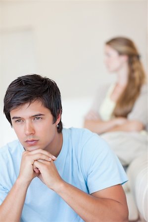 simsearch:400-05739935,k - Portrait of a sad couple after an argument in their living room Stock Photo - Budget Royalty-Free & Subscription, Code: 400-05746706