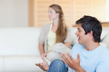 simsearch:400-05739935,k - Young couple arguing in their living room Stock Photo - Budget Royalty-Free & Subscription, Code: 400-05746708