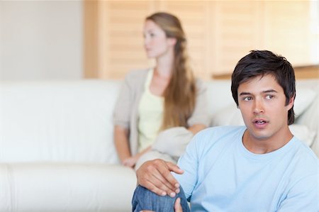 simsearch:400-06172922,k - Sad couple arguing in their living room Stock Photo - Budget Royalty-Free & Subscription, Code: 400-05746709