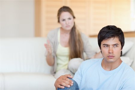 simsearch:400-05089878,k - Upset couple arguing in their living room Stock Photo - Budget Royalty-Free & Subscription, Code: 400-05746710