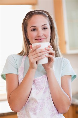 simsearch:400-04335902,k - Portrait of a quiet woman drinking a cup of coffee in her kitchen Stock Photo - Budget Royalty-Free & Subscription, Code: 400-05746899