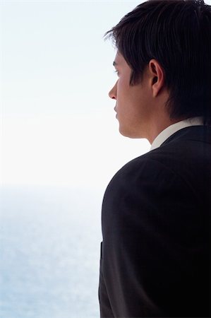simsearch:400-05718341,k - Portrait of a businessman day dreaming while looking at the sea Stock Photo - Budget Royalty-Free & Subscription, Code: 400-05746919