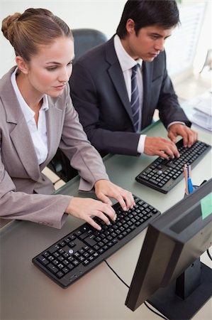 simsearch:400-04918393,k - Portrait of business people working with computers in an office Stock Photo - Budget Royalty-Free & Subscription, Code: 400-05746925