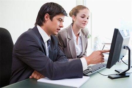 simsearch:400-04918393,k - Good looking business people working with a computer in an office Stock Photo - Budget Royalty-Free & Subscription, Code: 400-05746936