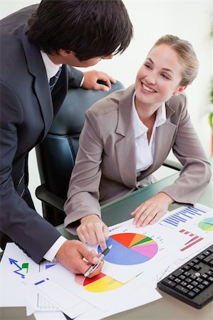 simsearch:400-04918393,k - Portrait of a young business team studying statistics in a meeting room Stock Photo - Budget Royalty-Free & Subscription, Code: 400-05746942