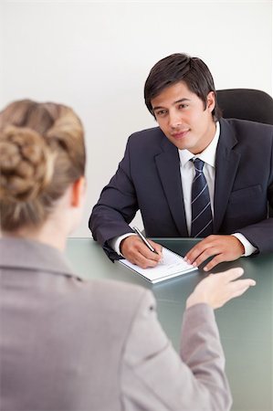 Portrait of a smiling manager interviewing a female applicant in an office Stock Photo - Budget Royalty-Free & Subscription, Code: 400-05746955