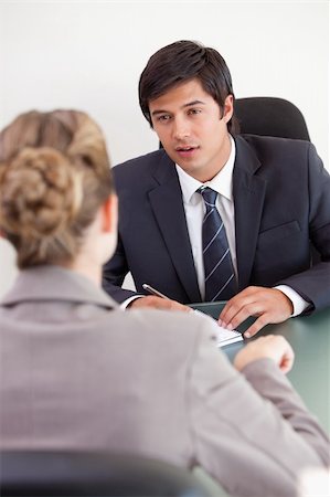 Portrait of a serious manager interviewing a female applicant in his office Stock Photo - Budget Royalty-Free & Subscription, Code: 400-05746956