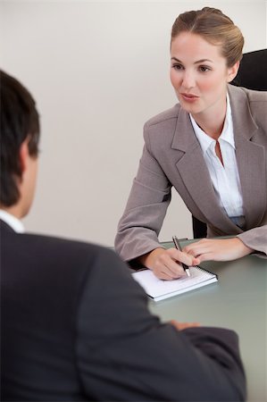 Portrait of a serious manager interviewing a male applicant in her office Stock Photo - Budget Royalty-Free & Subscription, Code: 400-05746959
