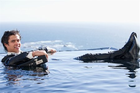 Businessman relaxing in a swimming pool in a suit Stock Photo - Budget Royalty-Free & Subscription, Code: 400-05746977