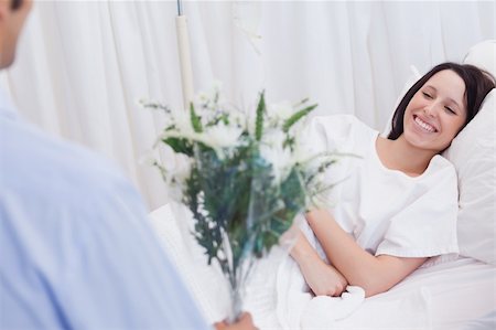 simsearch:400-04307817,k - Young woman getting visited in hospital Stock Photo - Budget Royalty-Free & Subscription, Code: 400-05747204