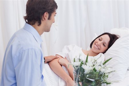 simsearch:400-04307817,k - Young man visiting his girlfriend in the hospital Stock Photo - Budget Royalty-Free & Subscription, Code: 400-05747205