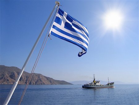 floating dock - Sea view with greek flag, mountain, sun and cargo ship Stock Photo - Budget Royalty-Free & Subscription, Code: 400-05747711