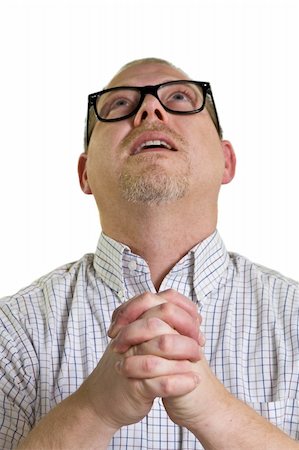 nerdy man with glasses begs forgiveness while looking up isolated on white Stock Photo - Budget Royalty-Free & Subscription, Code: 400-05747737