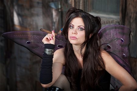 Beautiful and Caucasian fairy holds a cigar Stock Photo - Budget Royalty-Free & Subscription, Code: 400-05747795