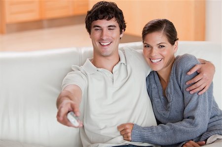 simsearch:400-05748048,k - Young couple watching television on the couch Stockbilder - Microstock & Abonnement, Bildnummer: 400-05748056