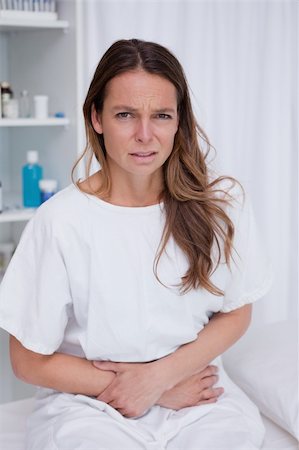 simsearch:400-06476910,k - Woman having really bad stomachache Stock Photo - Budget Royalty-Free & Subscription, Code: 400-05748183