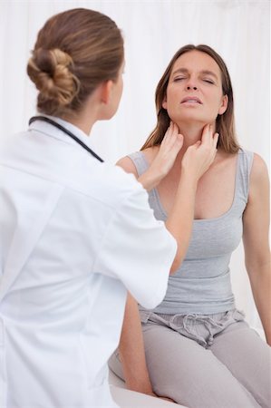 Doctor examining patients painful throat Stock Photo - Budget Royalty-Free & Subscription, Code: 400-05748204