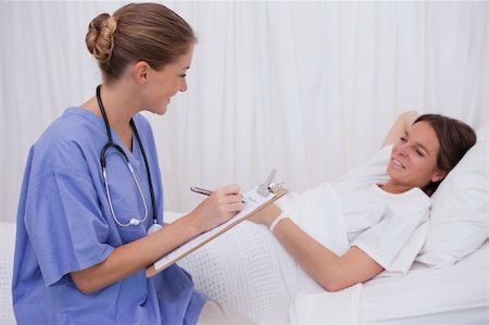 simsearch:400-05748268,k - Surgeon questioning bedridden patient Stock Photo - Budget Royalty-Free & Subscription, Code: 400-05748269