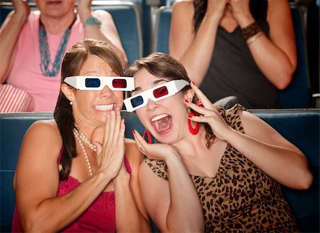 sensual in theater - Two excited Caucasian women with 3D glasses in a theater Stock Photo - Budget Royalty-Free & Subscription, Code: 400-05748514