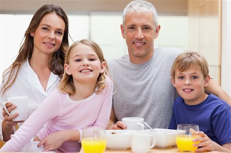 simsearch:400-05749624,k - Family having breakfast in their kitchen Stock Photo - Budget Royalty-Free & Subscription, Code: 400-05749500