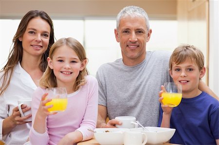 simsearch:400-05749624,k - Happy family having breakfast in their kitchen Stock Photo - Budget Royalty-Free & Subscription, Code: 400-05749501