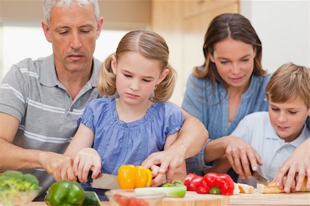 simsearch:400-05749624,k - Family cooking together at home Stock Photo - Budget Royalty-Free & Subscription, Code: 400-05749568